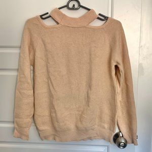 cream colored sweater with shoulder cutouts
